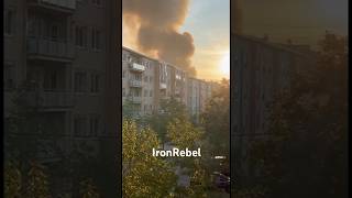 Distant Footage: Building Near Tree Line Engulfed in Thick Smoke After Blast