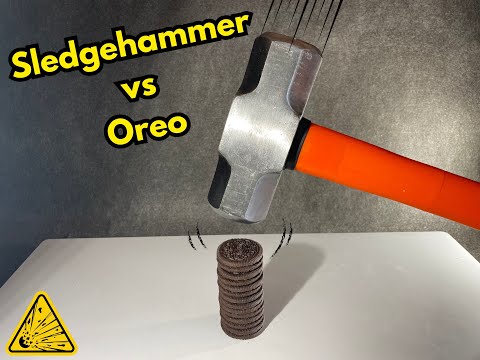 Crushing a stack of oreo cookies with a big sledgehammer in slow motion