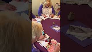 Jean praying over angel gowns.