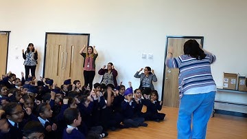 Falcons Primary School children sing "Put Your Thinking Cap On"