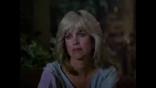 Phyllis Davis, braless blue tunic—