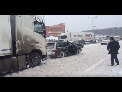 forester,-towing-a-trailer-truck,-on-snow,-in-russia,