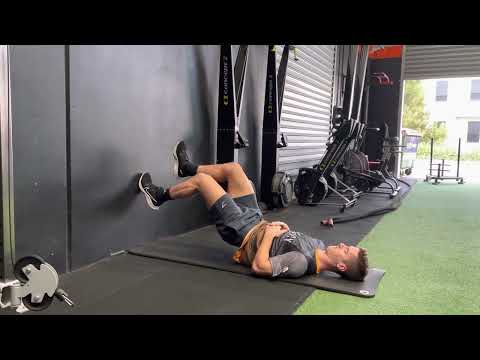 Wall hamstring bridge with calf raise (isometric)