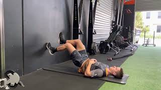 Wall hamstring bridge with calf raise (isometric)