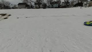 20201224 snowboarding sliding sledding up hill Boston backyard 8