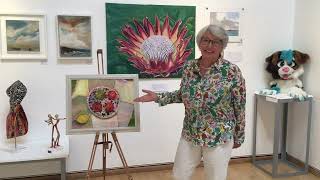 Saskia James at the Elmbridge Moving Art Exhibition with her artwork: 'My Favourite Plate'.