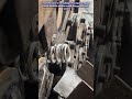 Automated industrial process manufactures precision compression springs continuously.