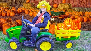 Damian and Darius pick up pumpkins for Halloween