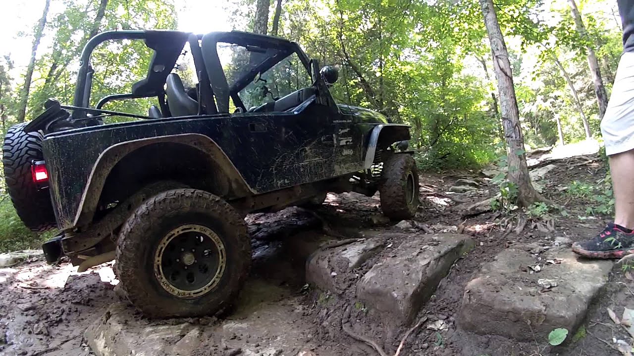 Jeep Wrangler TJ Muddy Rock Crawling - YouTube