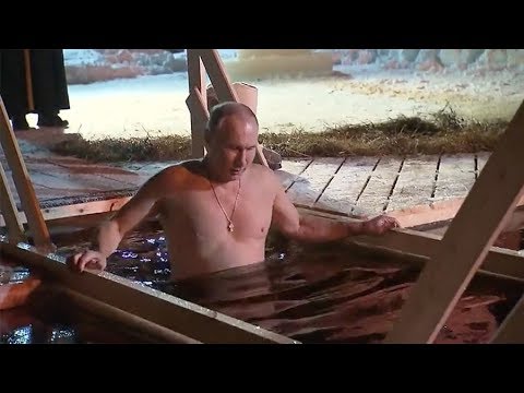 Putin braves icy water for traditional Epiphany dip