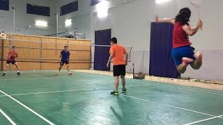 Short girl jump smash in badminton