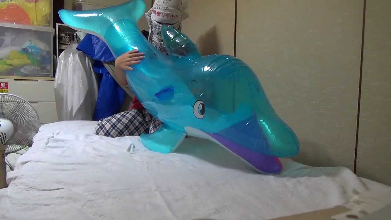 Megan masturbates in the pool on inflatable toy