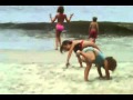 Girl Cousins Trying Cartwheels on the Beach