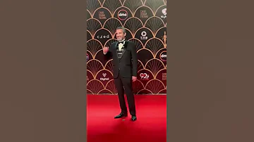 الفنان احمد عبدالعزيز وزوجته دينا شرف الدين على السجادة الحمراء فى مهرجان القاهرة للدراما 2022 
