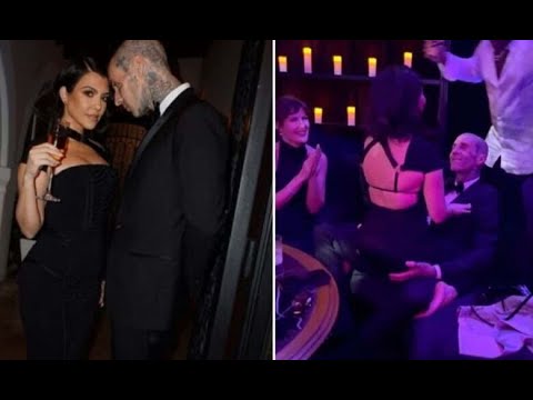 Kourtney Kardashian dances on top of Travis Barker at wedding