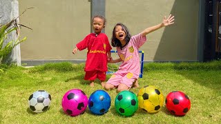 Playing soccer, Adek scoring goals, Alysha & Arshaka learning the color of the ball