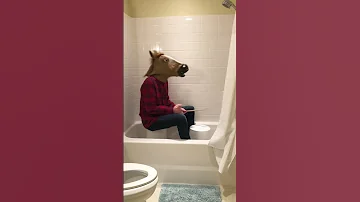 Man-horse plays "Paranoid" by Black Sabbath on a bucket in the bathtub