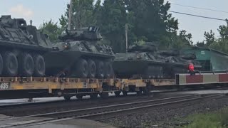 Westbound CSX Mixed Freight With L & N Heritage Unit And Carrying Miltary Armored Personnel Carriers