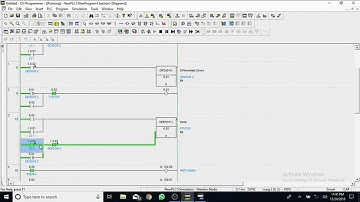 program simulasi pintu garasi otomatis menggunakan aplikasi CX-Programmer dan CX-Designer