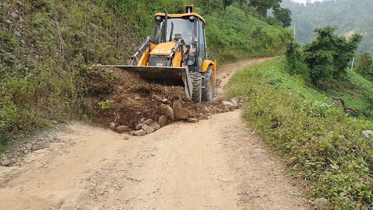 Filling Ruts and Leveling the Hilly Road With Jcb Backhoe