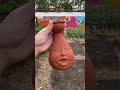 Burying a clay face in my garden