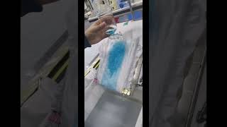 Diaper Slip Seepage Test. Water Is Absorbed Quickly And No Liquid Flows Down.