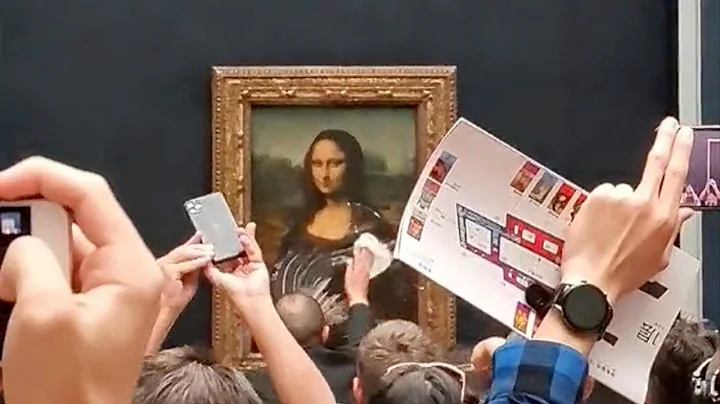 Man in wig throws cake at glass protecting Mona Lisa I ABC7