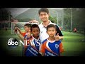 Community rallies behind Thai soccer coach after rescue