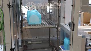 Vertical conveyor transporting canisters