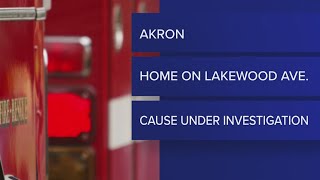 2 adults displaced, 7 dogs rescued amid Akron house fire