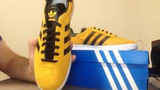 black and yellow adidas gazelles