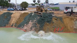 Perfect Bulldozer Dropping Dirt into Water with Dump Truck on Road Construction Best Processing