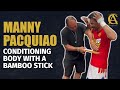 Manny pacquiao conditioning body with bamboo stick wow