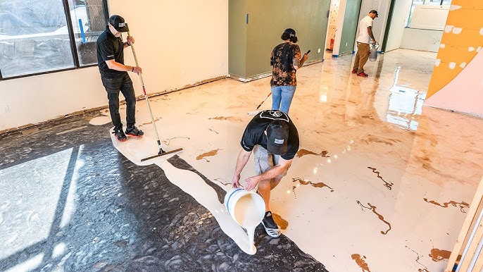 Tyler Applying Pebble Apoxy Floor in Grindbygg Workshop