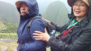 Machu Picchu: Under rainy and foggy sky.