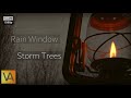 Storm Lantern with Rain on Window and Wind through Trees