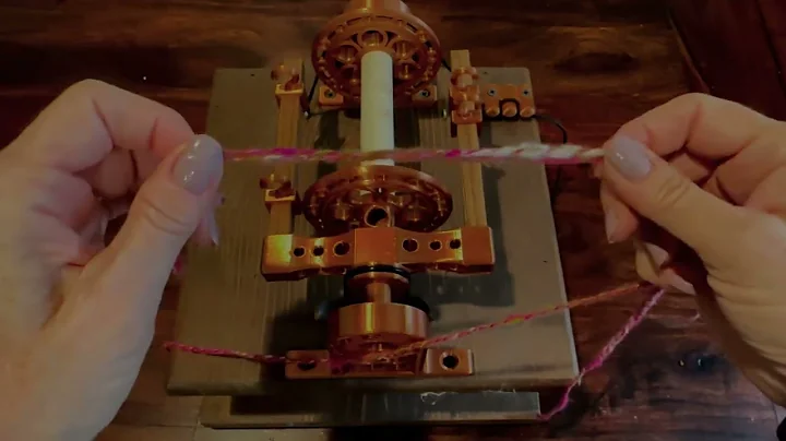 Attaching a leader on a bobbin when spinning yarn on a spinning wheel.  Camaj Fiber Arts