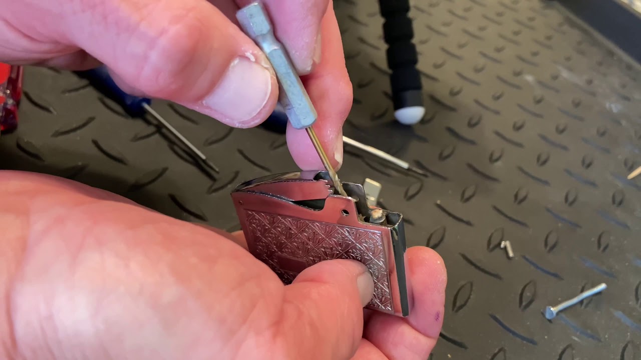 How To Disassemble and Reassemble A Flat Ad Cigarette Lighter to Clear The Flint Tube From The