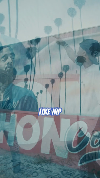 J Outlaw Shoots Special Delivery At Nipsey Hussle Square Mural in the marathon clothing alley