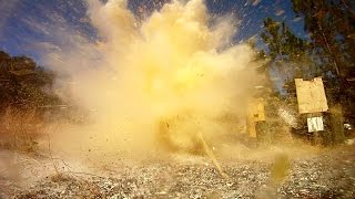 Shooting Tannerite with assault rifle AR15 in Slow Motion Pumkin Jack-O-Lantern