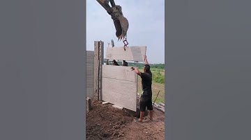 The process of installing pre fabricated concrete fence panels with an excavator #smartwork