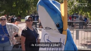 Man in shark costume trolls Vice News at straight pride parade