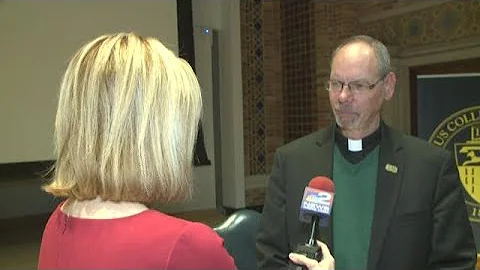 Father Bob Zilliox talks with Maryalice Demler
