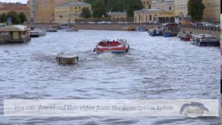 Footage. One of the rivers of St. Petersburg the bridges across the river and floating a river boat.