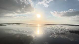 Sunset on the ocean after low tide. Xiangxie Boardwalk in Taiwan.