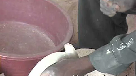 Fair trade artisans in Kisii, Kenya working on their soapstone piece