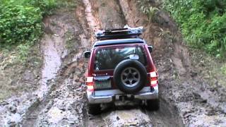 Mitsubishi Pajero Field Master 2004 in steep muddy hill climb