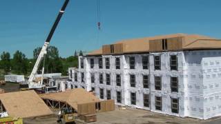 Crane picking a modular building