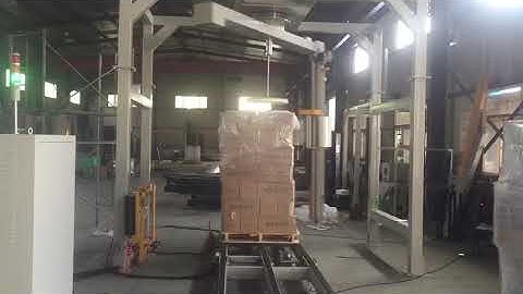 Fully automatic rotary arm stretch wrapping machine