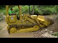 Dozer cleaning up creek